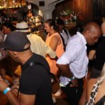 Soul music lovers enjoying a packed bar at Soul Fiesta with live DJ playing.