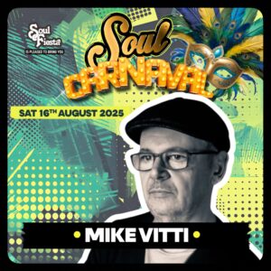 Mike Vitti, vinyl soul specialist, in signature flat cap and glasses, serving dancefloor classics at Soul Fiesta: Soul Carnival in Essex.